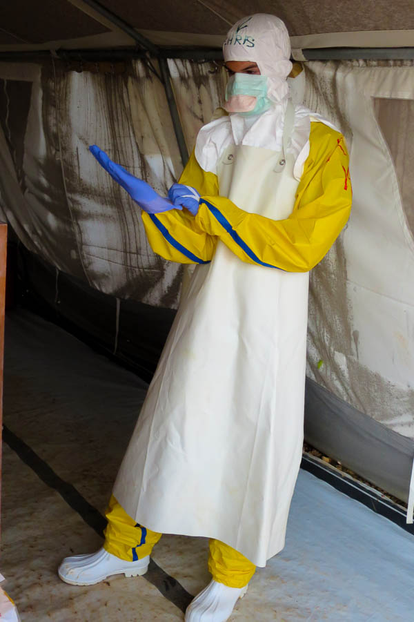 Dressing up in full personal protective equipment (PPE) in Kailahun, Sierra Leone