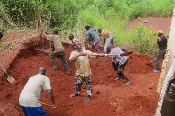 Daily workers digging laterite soil outside Grimari, Central African Republic