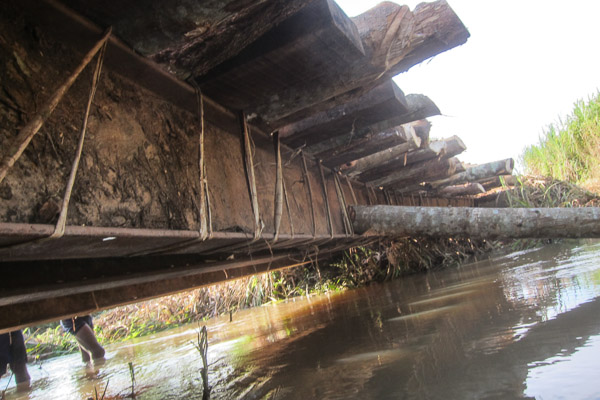 Timbers and logs lashed onto metal bridge beams at Pont Bongou, Central African Republic