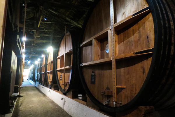 Enormous barrels of Taylor's port ageing in the cellars at Porto