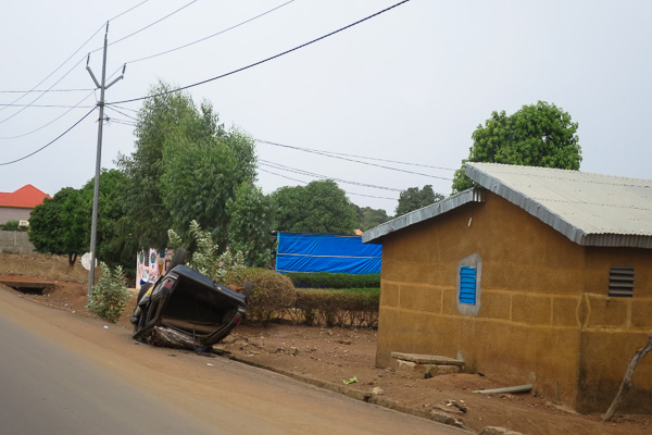 Flipped car in the outskirts of Kankan, Guinea