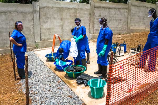 Training hygienists how to disinfect and clean reusable equipment at the Red Cross Ebola operational base in Dubréka, Guinea