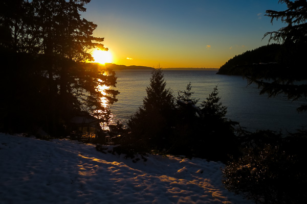 Sunrise over West Vancouver and the snow-covered lawn at Bowen Island